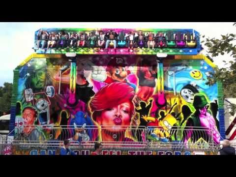 Miami Crazy Dance fairground ride operating with riders aboard