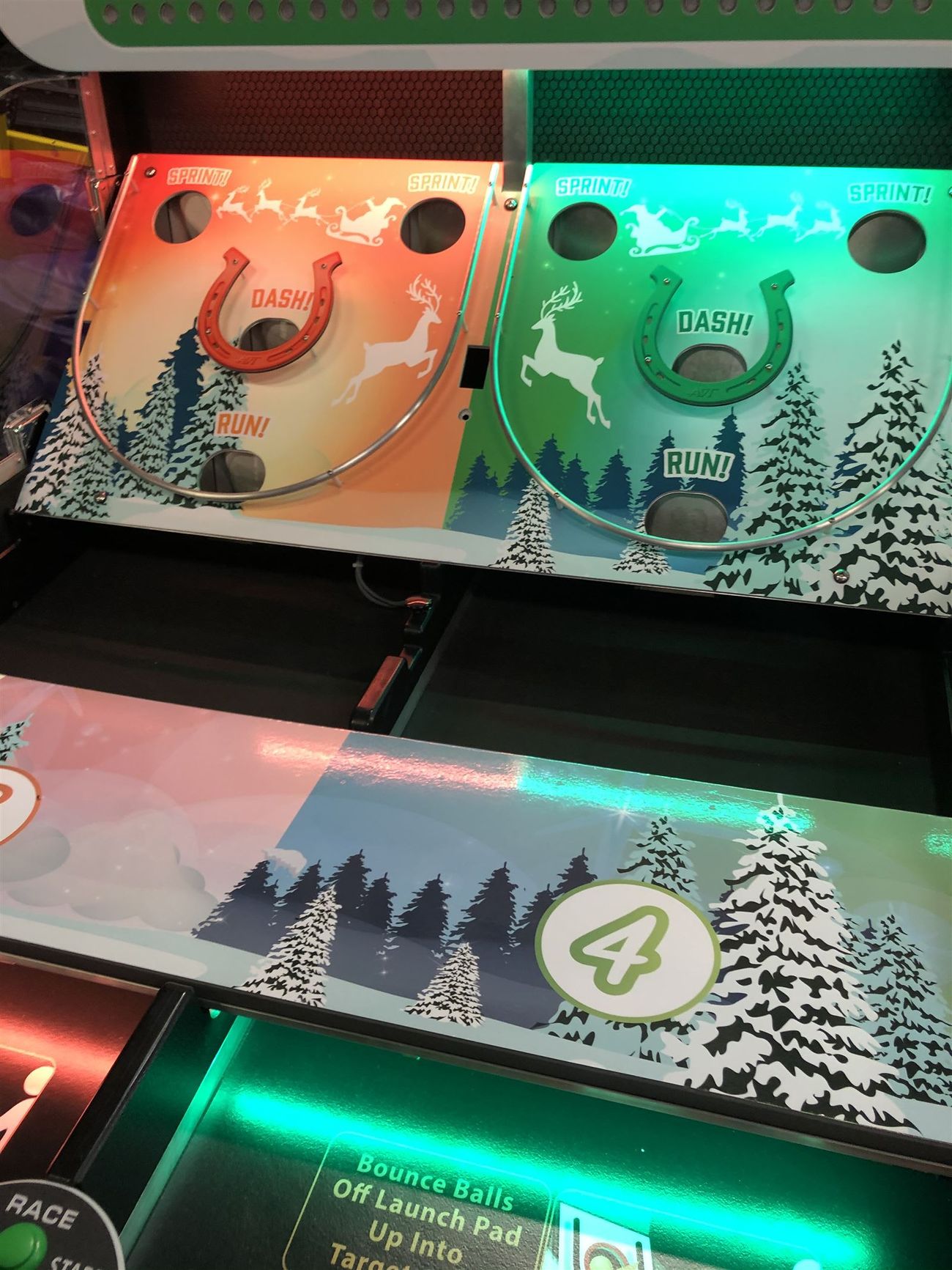 Detail of the horseshoe target holes on the Bounce A Ball Reindeer Racing playfield