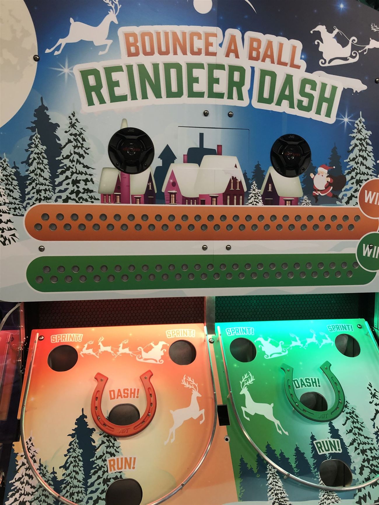 The snowy village backdrop above the Bounce A Ball Reindeer Racing launch pads