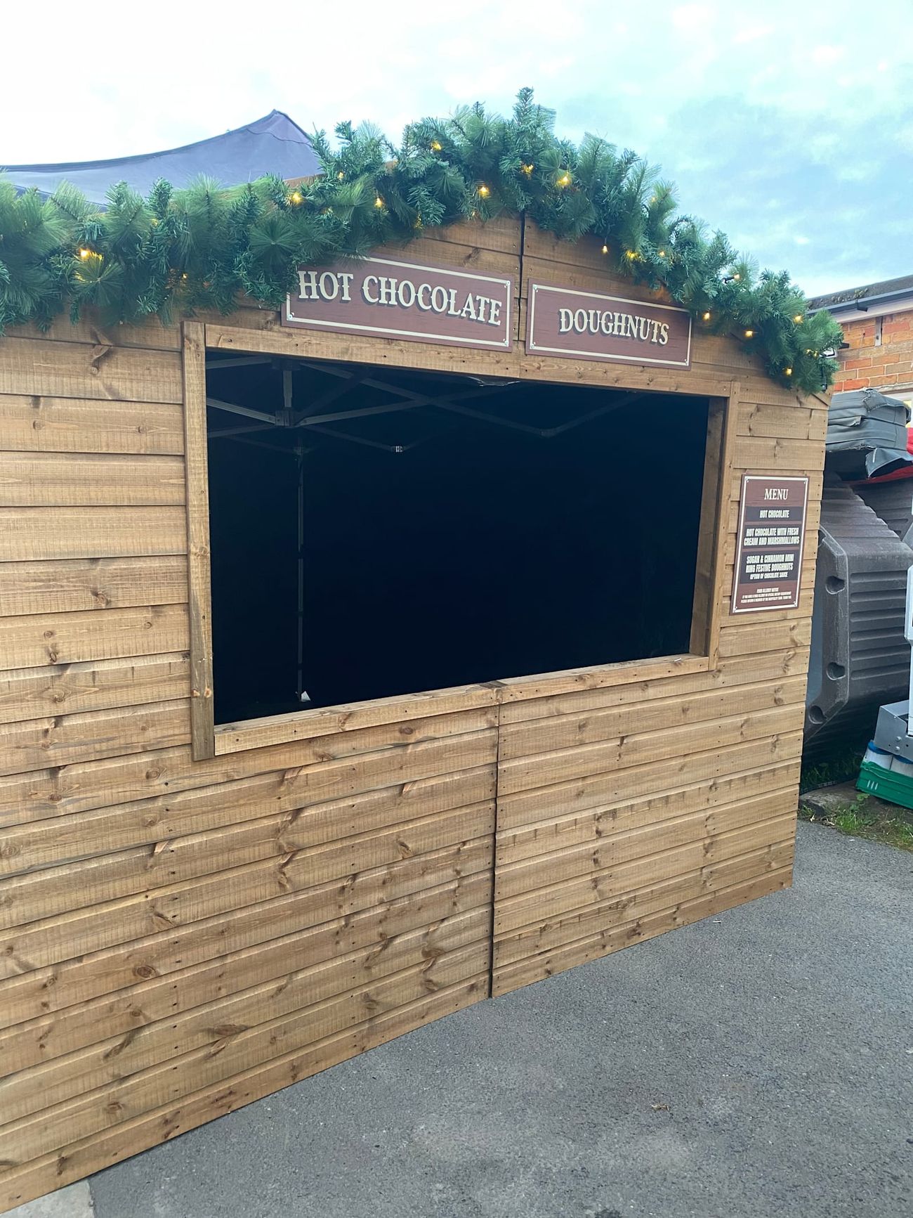 A Christmas market stall set up in a small yard, showing its 3m by 4.5m footprint