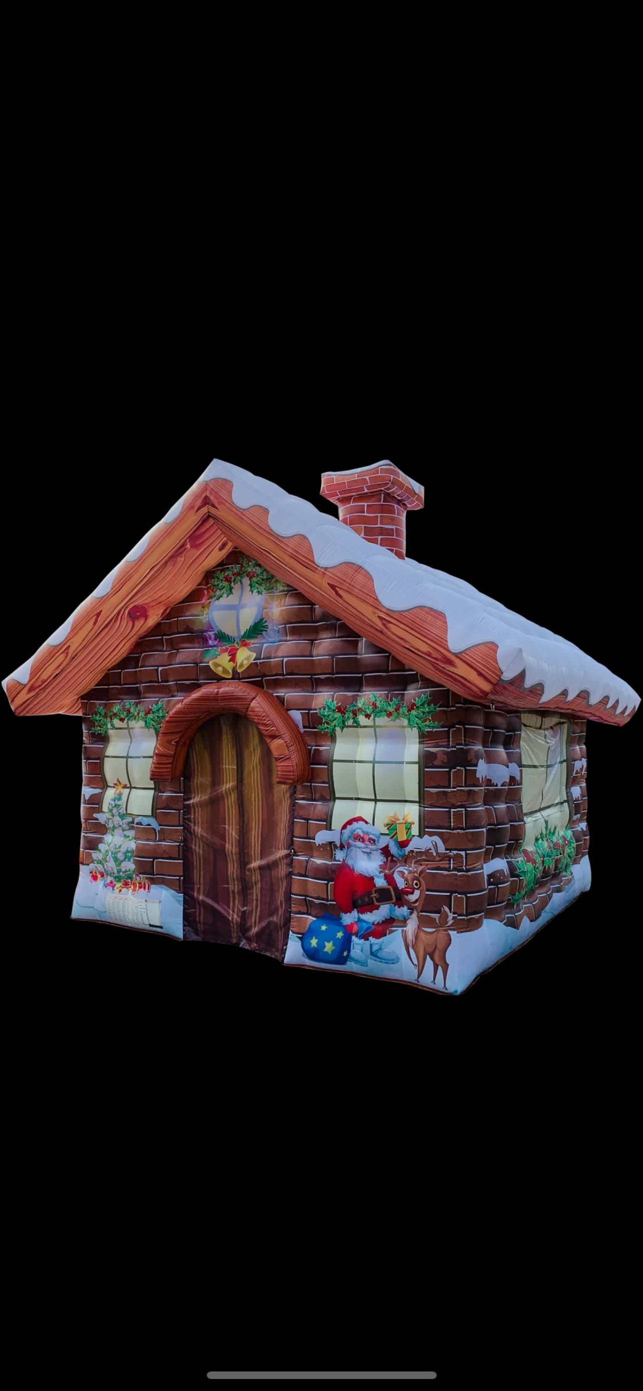 Product view of the Deluxe Santa's Grotto Cottage on a dark background, showing the chimney and snow detailing