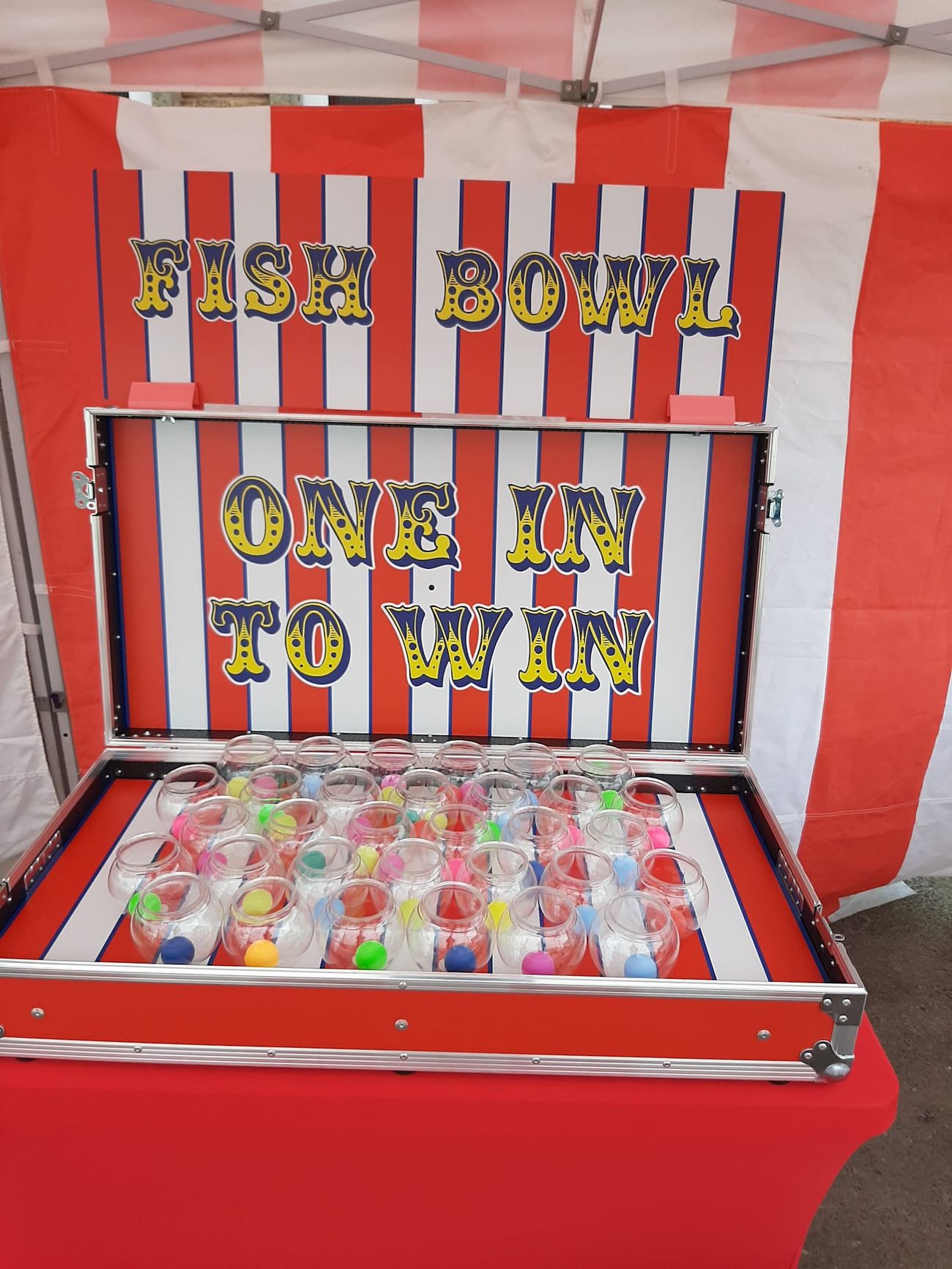 The Fish Bowl Challenge game board with its grid of fish bowls and striped backboard