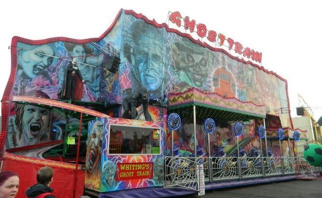 Left side of Whiting's Ghost Train showing the curving entrance track, ticket booth, painted frontage and loading platform