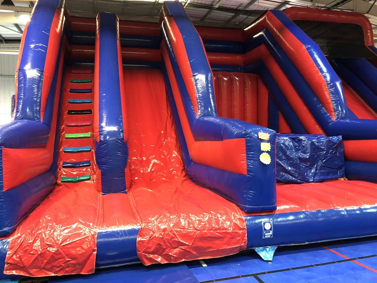 The inflatable set up in a warehouse, showing the full scale of the structure