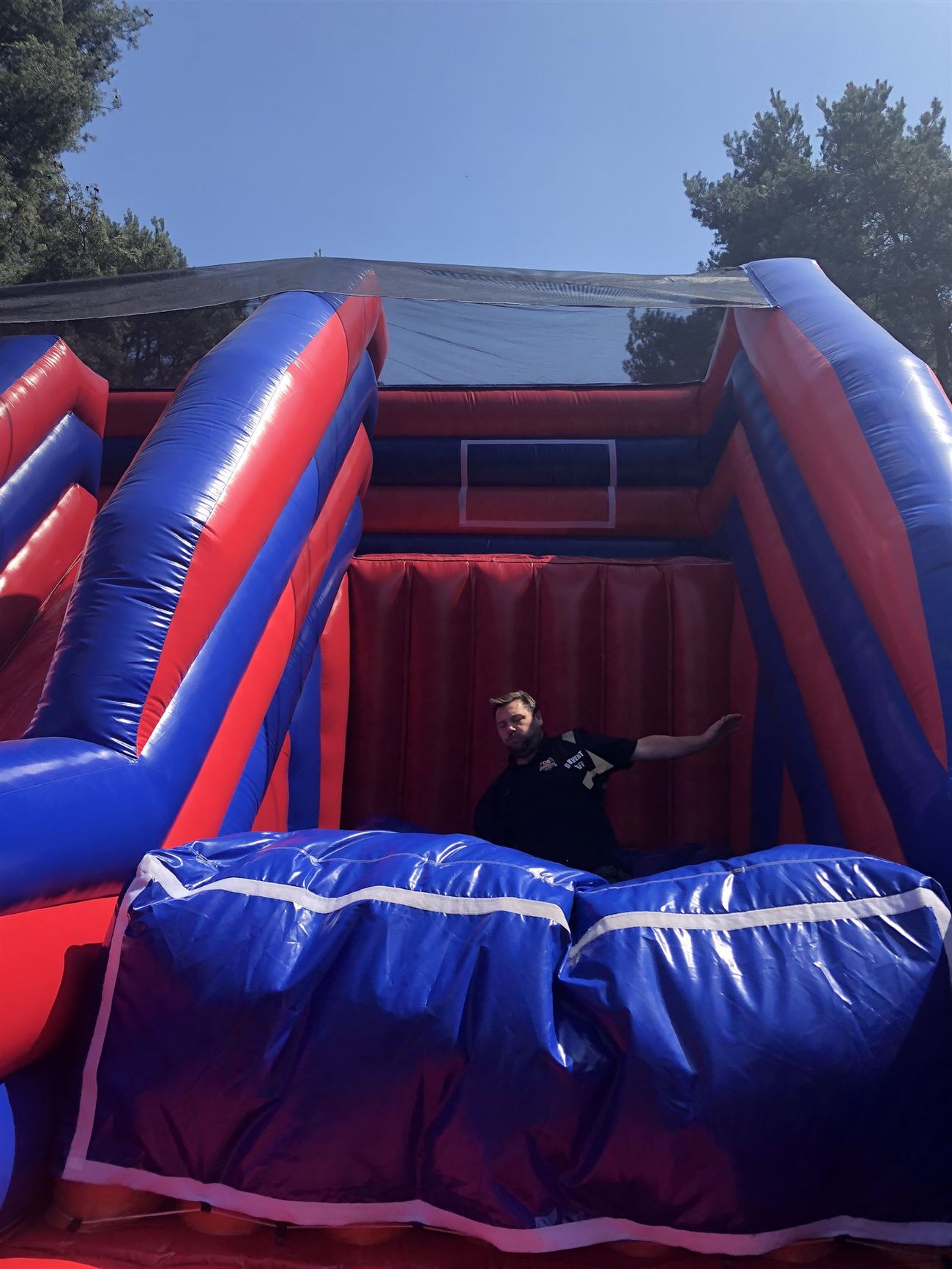 A person inside the inflatable structure, showing the scale relative to an adult