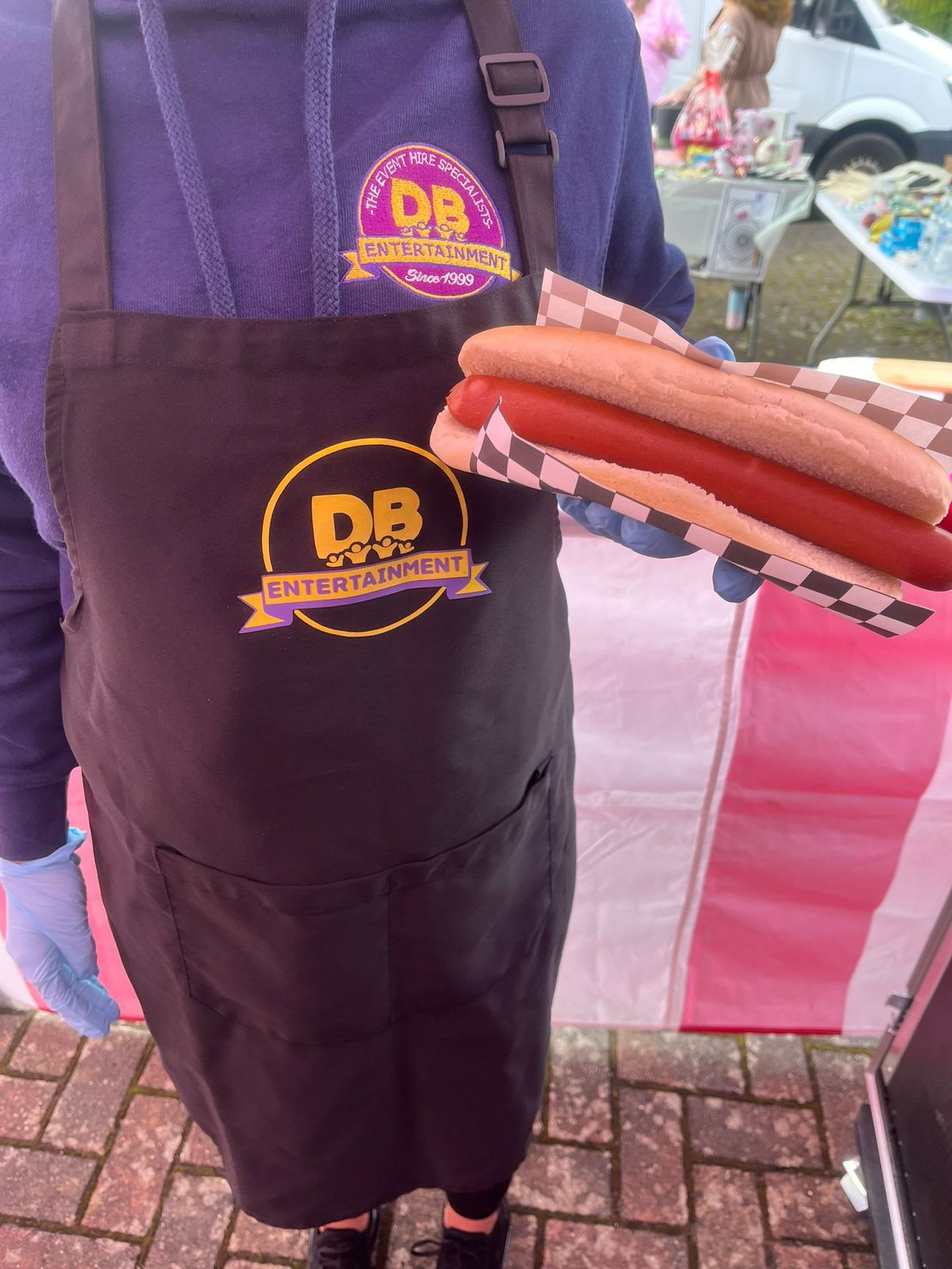 A guest holding a jumbo hot dog at an event
