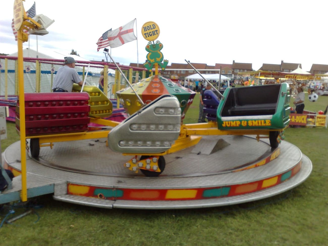 The themed cars on the platform, showing the arms and the diamond-plate steel floor