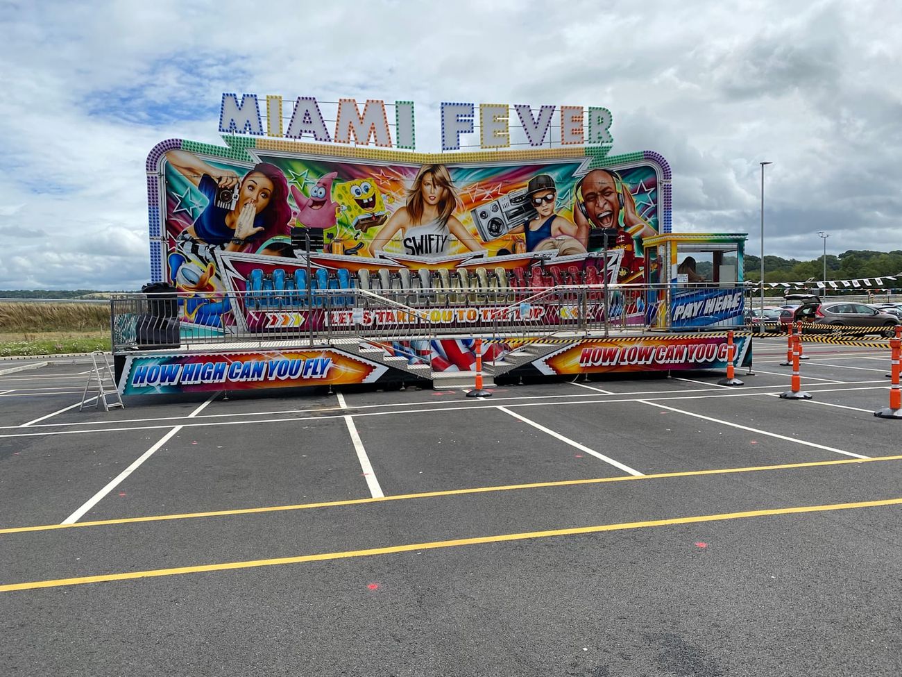 Miami Fever ride within a cordoned corporate fun-day setup on hard standing