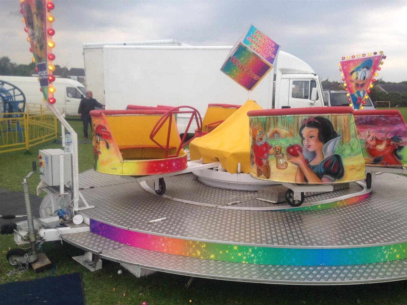 The ride at a travelling fair, with the delivery van behind it