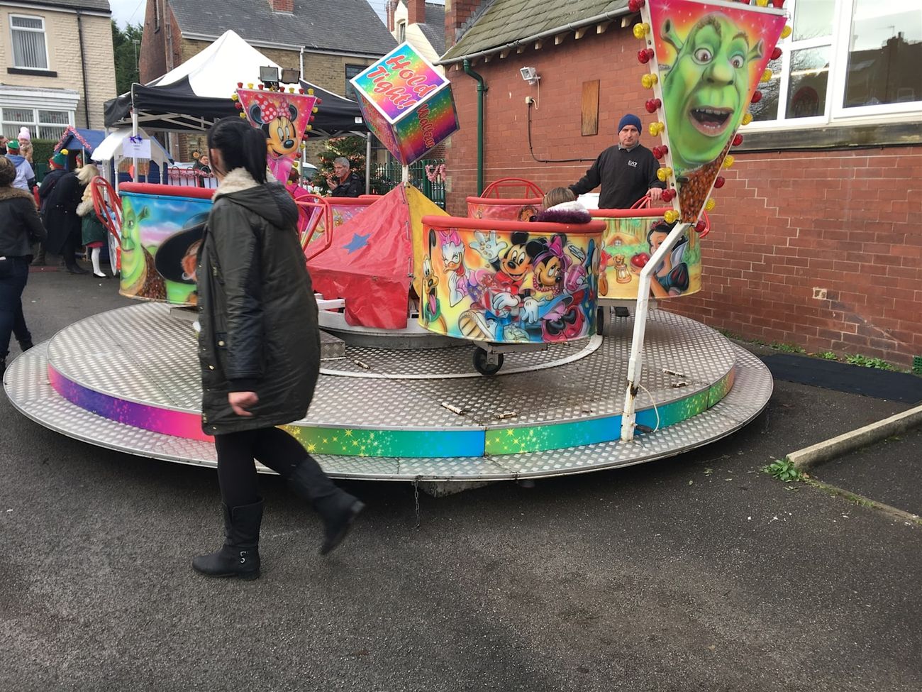 The mini waltzer showing its tubs on the diamond-plate platform with the rainbow-gradient edge and white stars