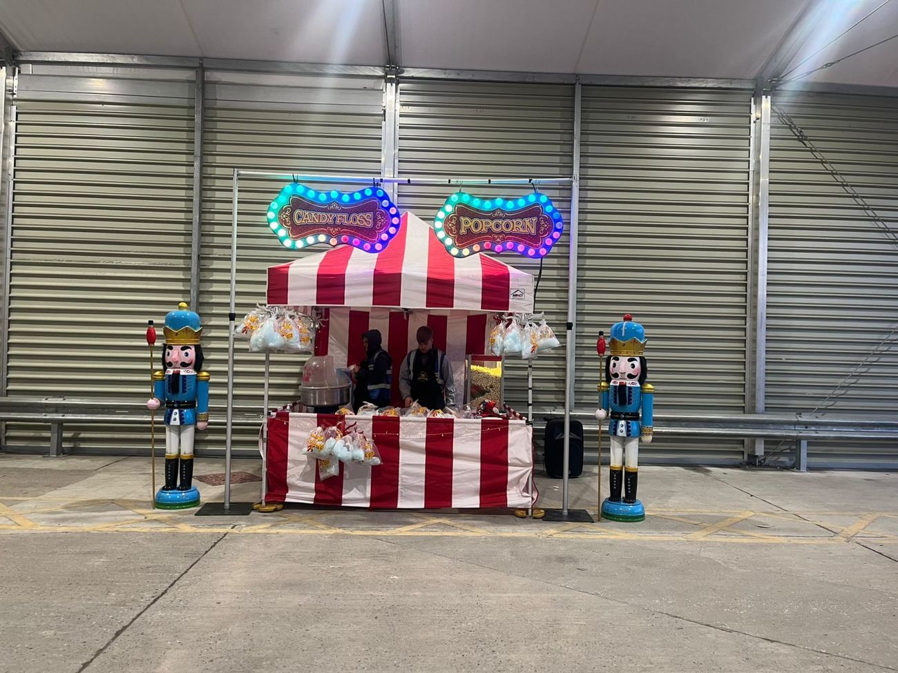 Nutcracker figures flanking a candy floss and popcorn stall
