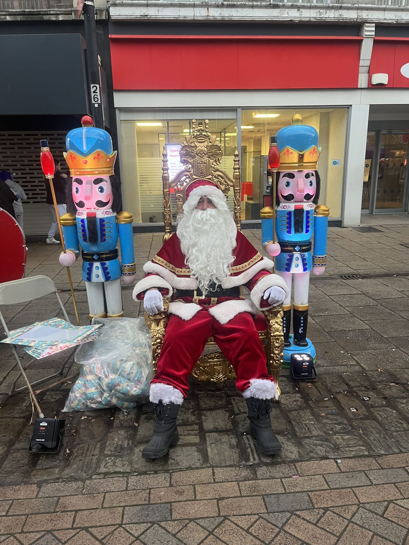 Two nutcracker figures standing either side of Santa's grotto throne