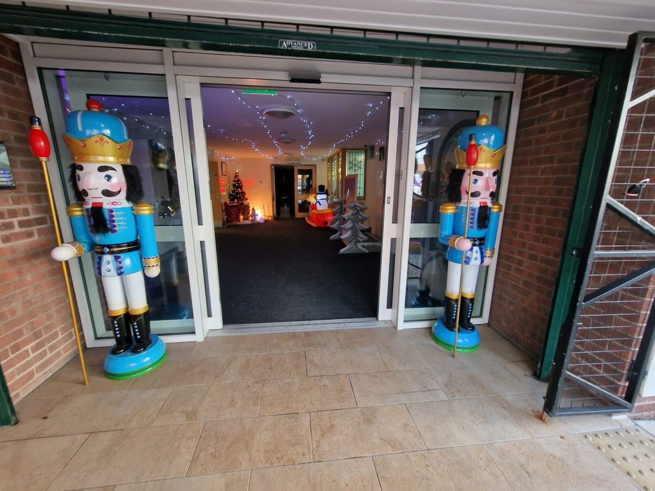 Nutcracker figures guarding an indoor venue entrance doorway