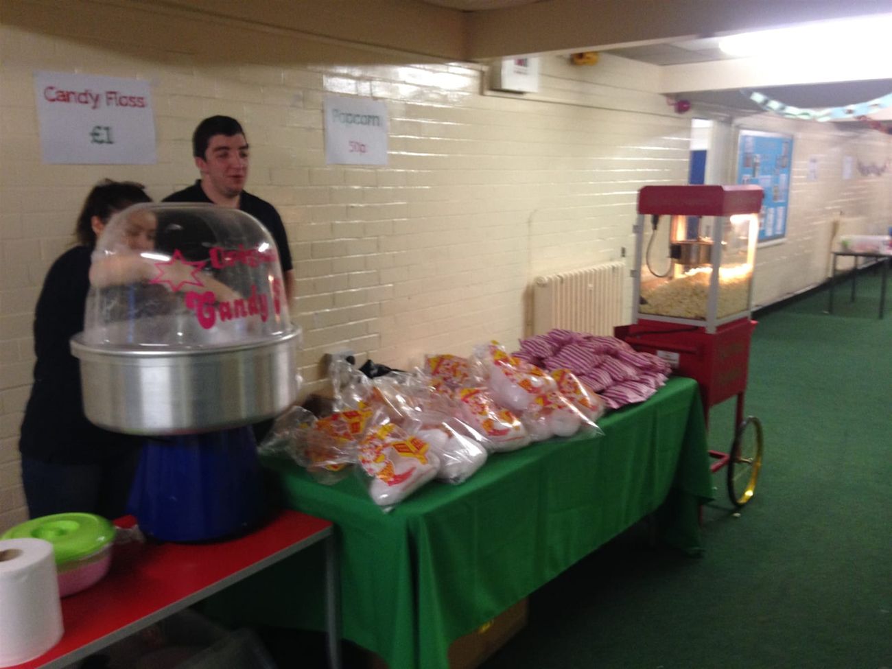 The popcorn cart set up at an indoor school event