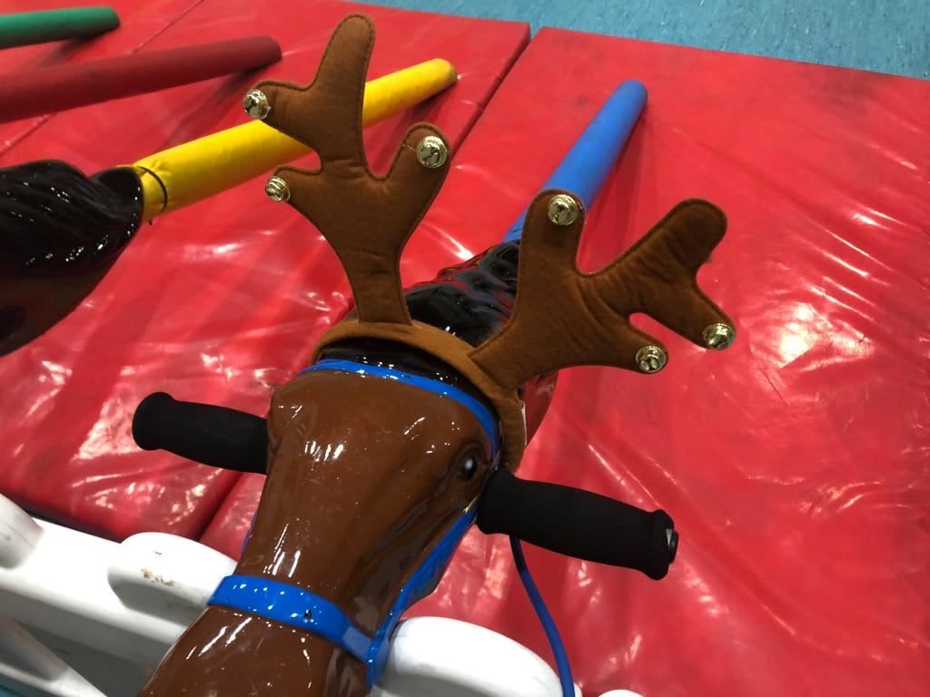 Close-up of the antlers and handlebars on a blue Reindeer Racing player control