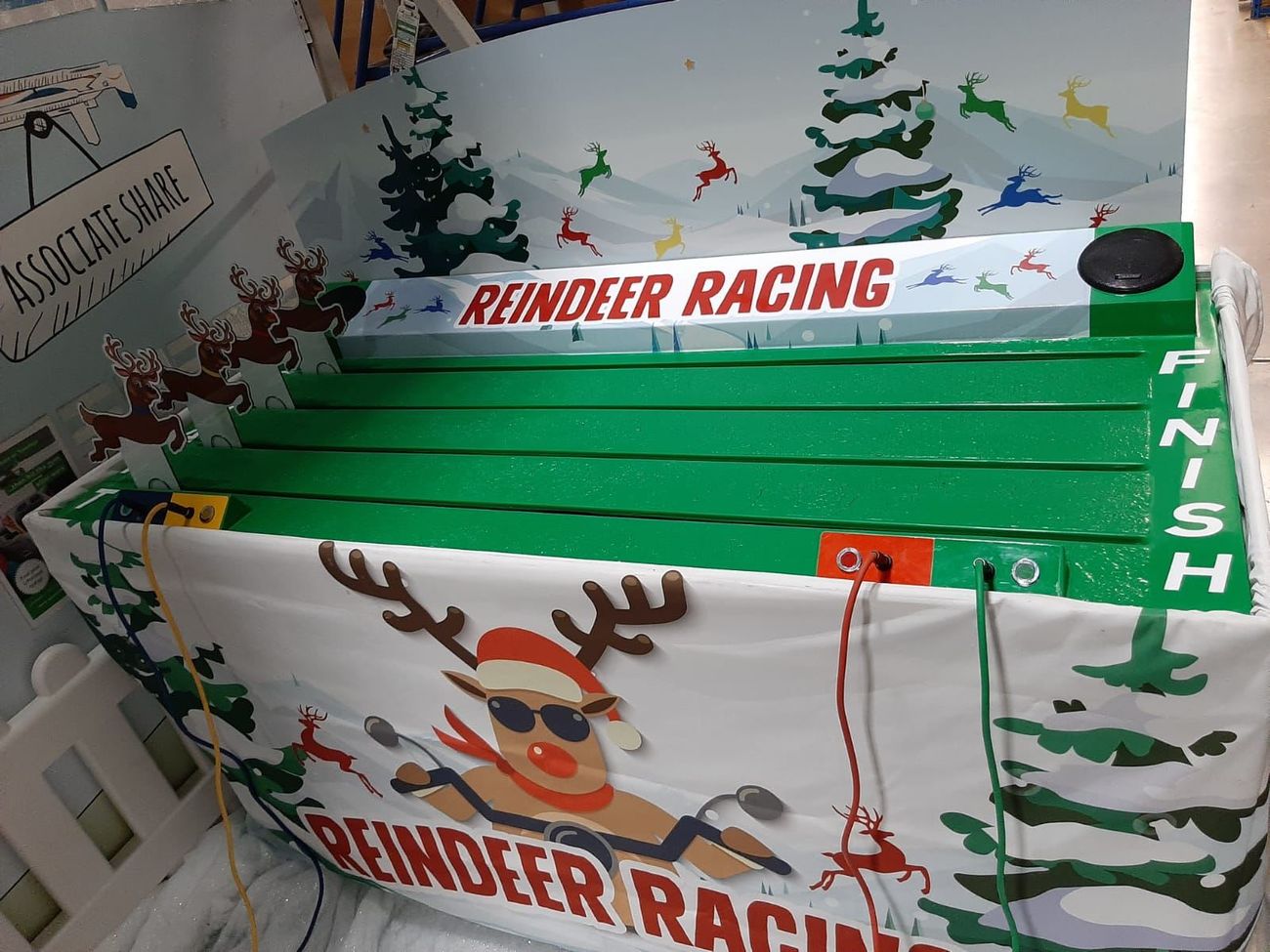Close-up along the Reindeer Racing tabletop track towards the finish line