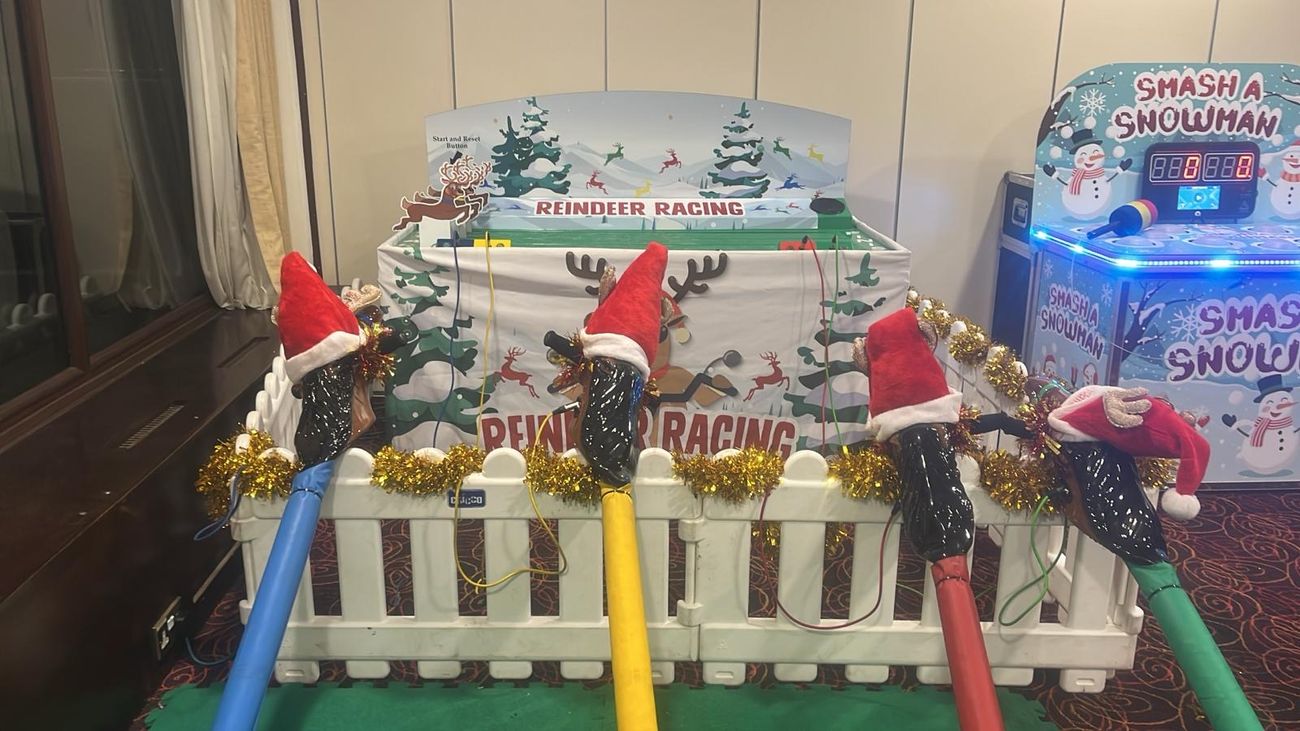 The tinsel-trimmed Reindeer Racing game set up beside another festive side game