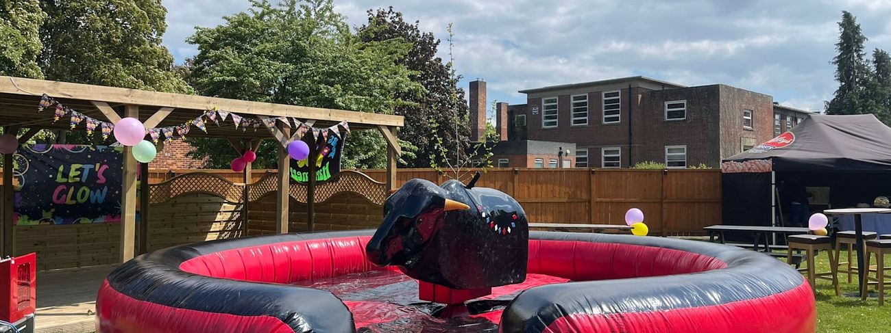 Mechanical rodeo bull on its inflatable safety bed outdoors
