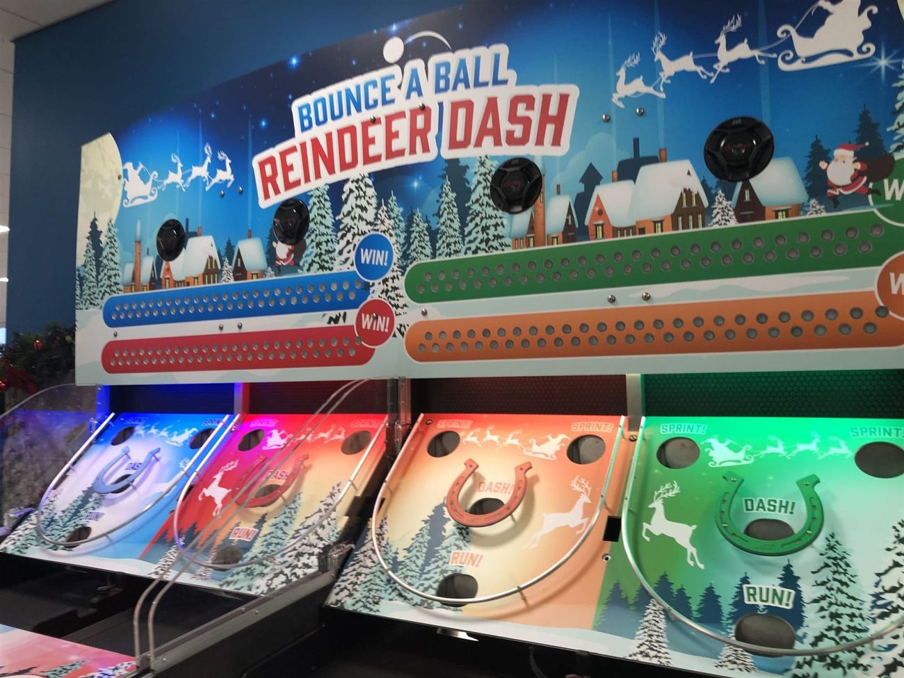 An angled view of the four colour-coded Reindeer Racing playfields with winter racing graphics