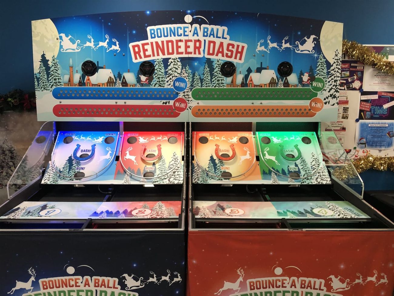The four-lane Roll A Ball Reindeer Racing setup with blue, red, orange and green illuminated scoring tracks