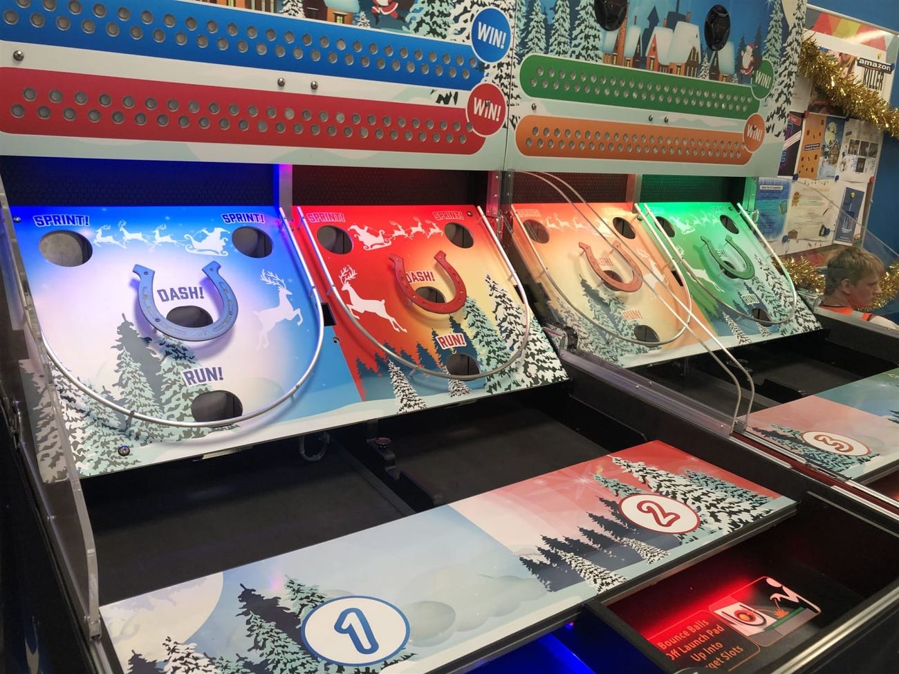 Horseshoe targets and numbered scoring slots on the Roll A Ball Reindeer Racing playfield