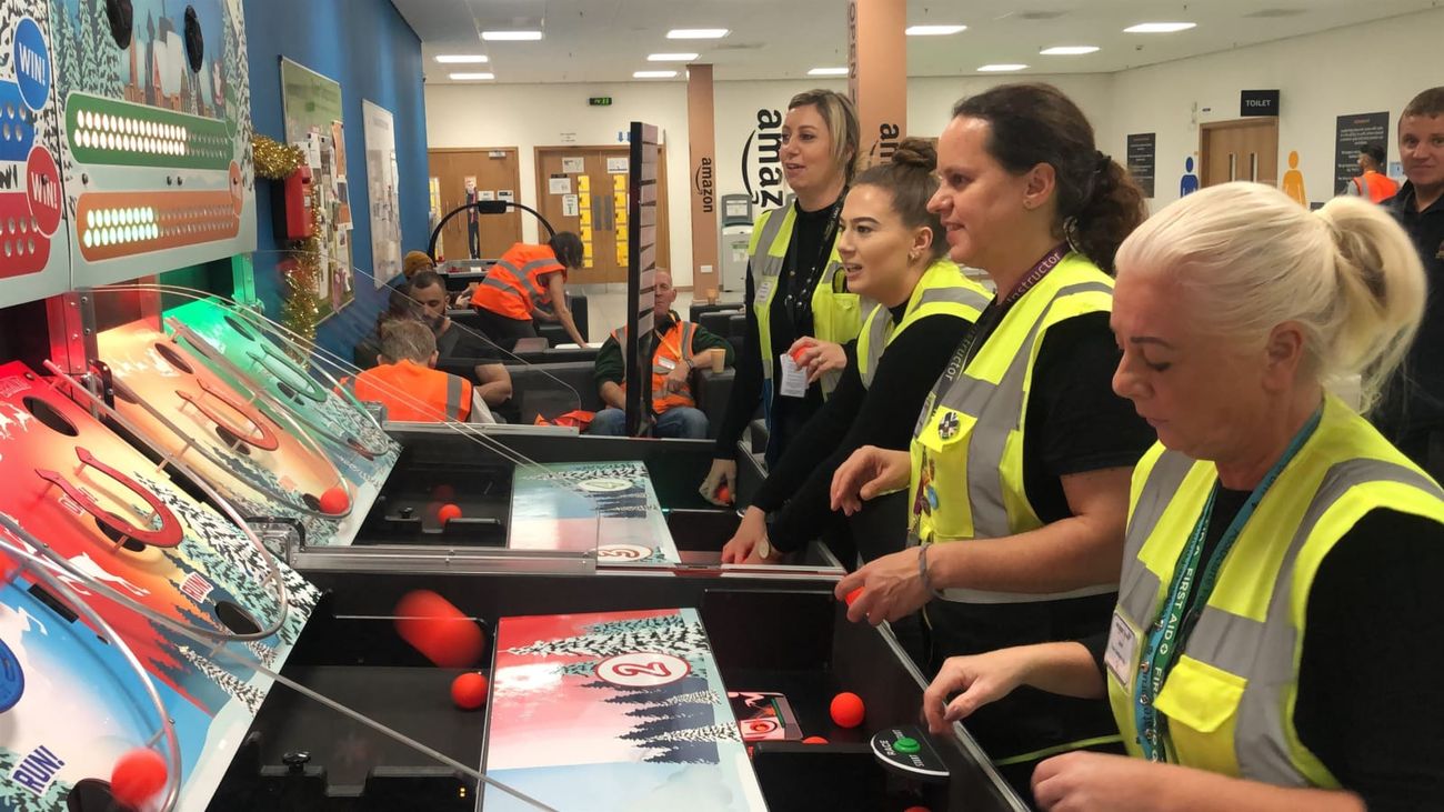 Players launching balls up the four colour-coded reindeer racing lanes
