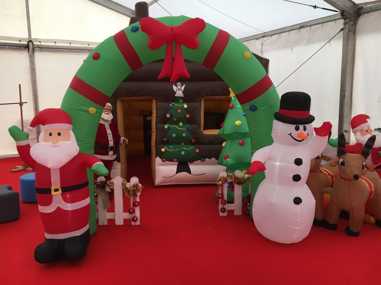 The Santa's grotto set up inside a marquee, with Santa at the doorway