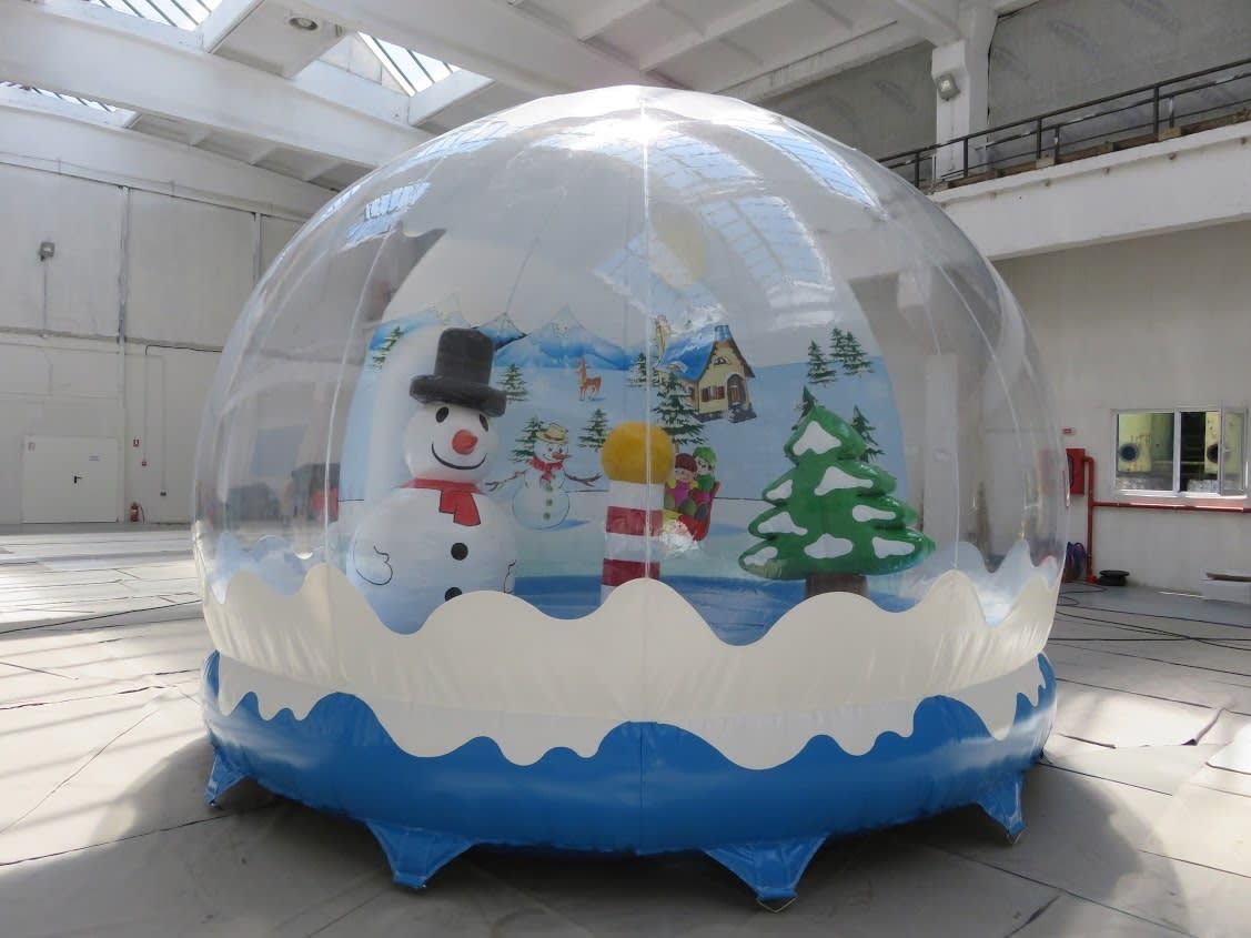 The fully inflated snow globe pod indoors with the complete winter scene