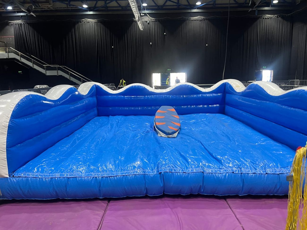 The blue inflatable surround with its scalloped wave-crested edges