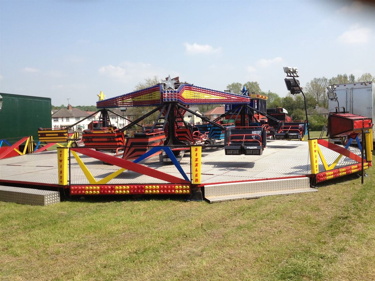 Empty Twister platform showing three sweep arms, bench cars, checker-plate deck and perimeter fencing