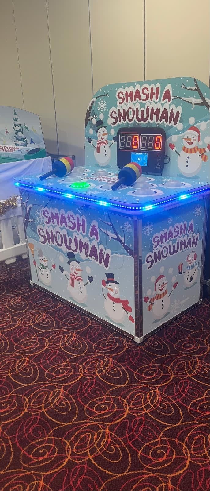 The complete Whack a Snowman cabinet with backboard, score display and both mallets ready to play