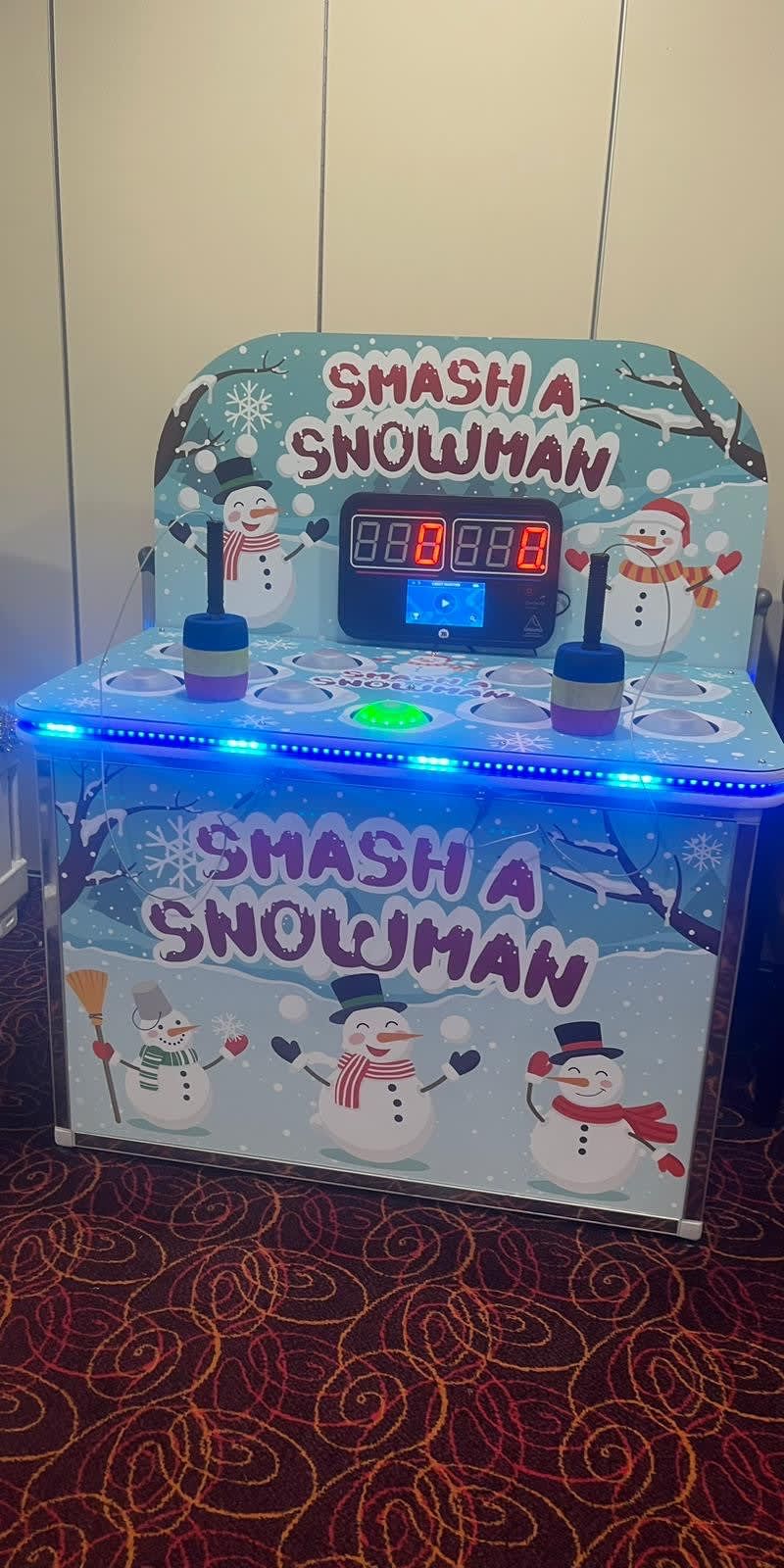 The Whack a Snowman cabinet front-on showing the full snowman artwork, score display and play surface