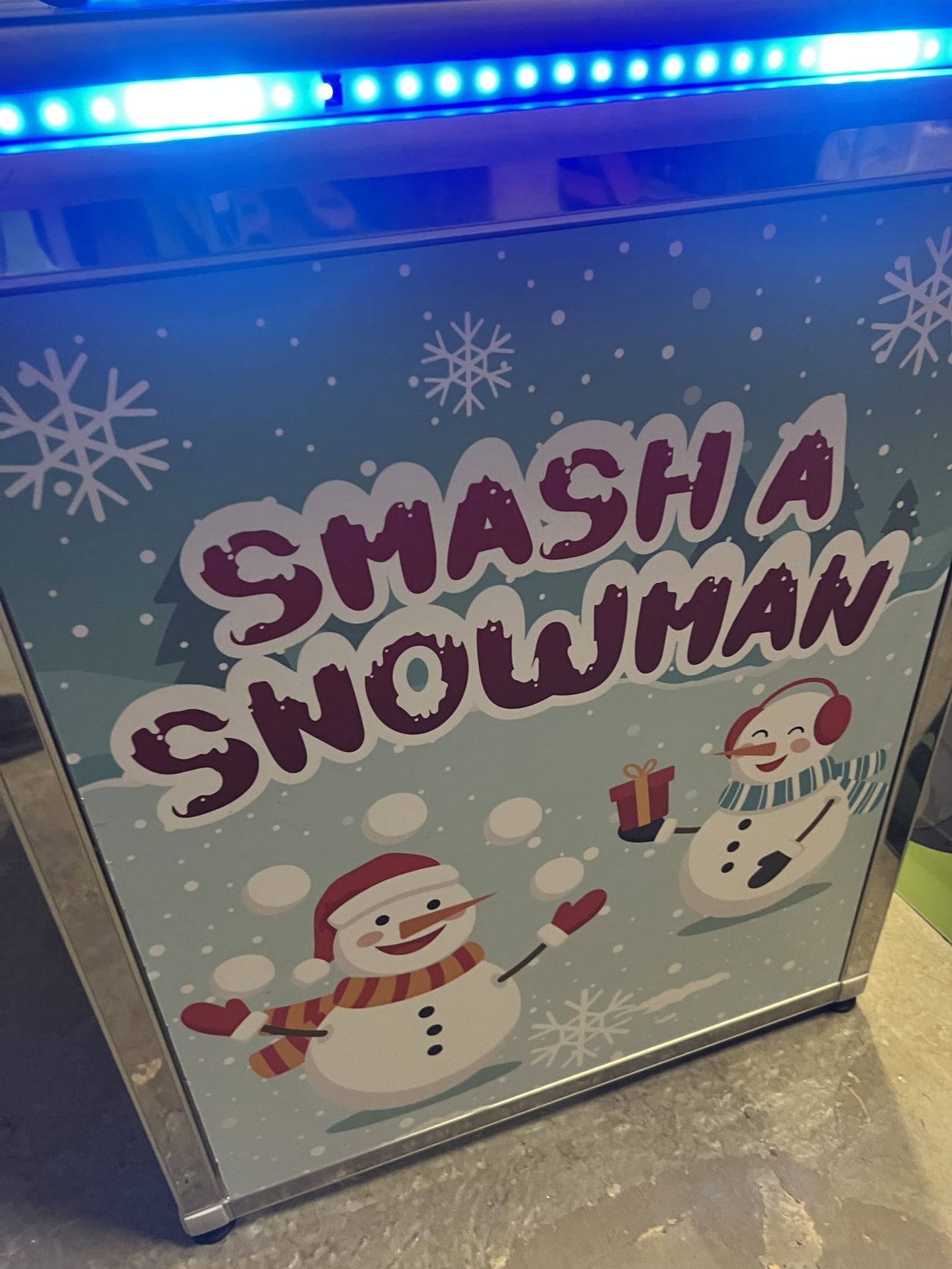 The Whack a Snowman front panel artwork with Smash a Snowman in snow-covered lettering and two cartoon snowmen